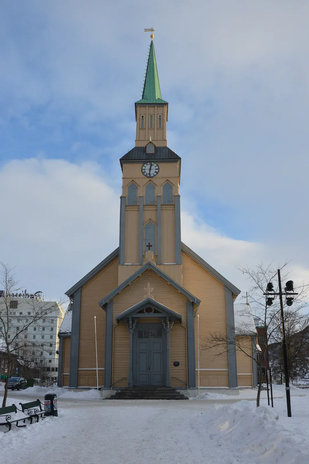 The wooden Tromsø Cathedral in winter snow, in the town centre where family Tromso reindeer sledding tours meet