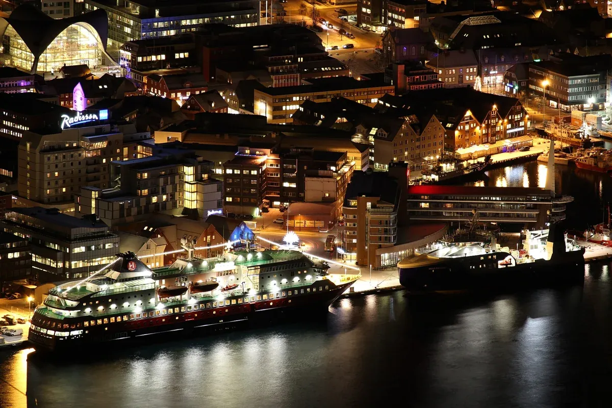 Tromsø harbour and the bus terminal area at night, where the reindeer and northern lights tour from Tromsø meets